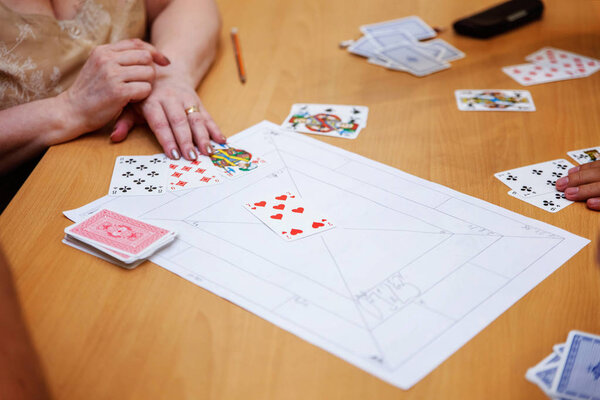 close up view of cards in hands