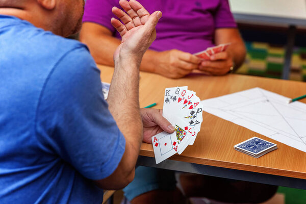 close up view of cards in hands