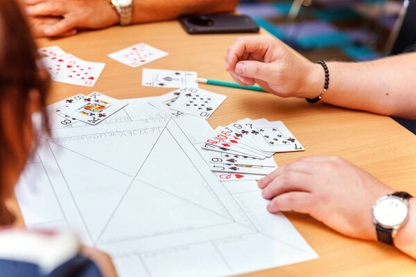 close up view of cards in hands
