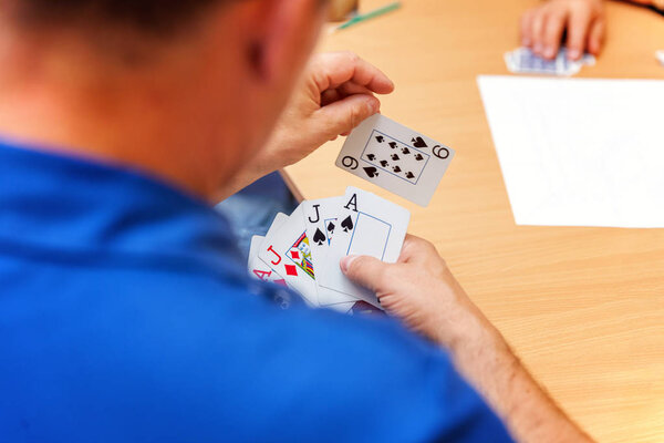 close up view of cards in hands