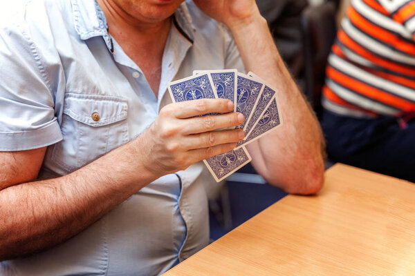 close up view of cards in hands