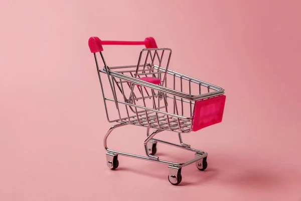 Small Supermarket Grocery Push Cart Shopping Toy Wheels Isolated Pink — Stock Photo, Image