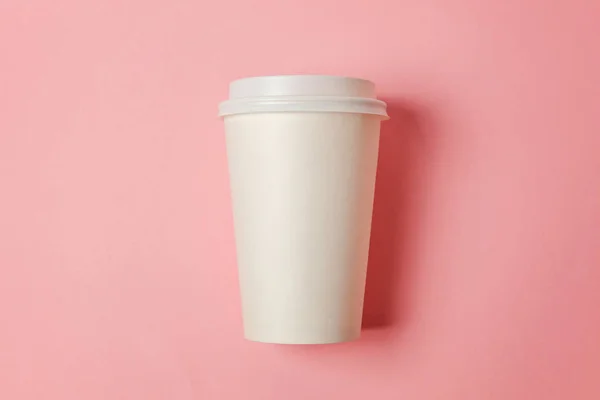 stock image Simply flat lay design paper coffee cup on pink pastel colorful trendy background. Takeaway drink container. Good morning wake up awake concept. Template of drink mockup. Top view copy space
