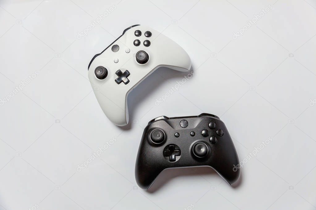 White and black joystick on white background