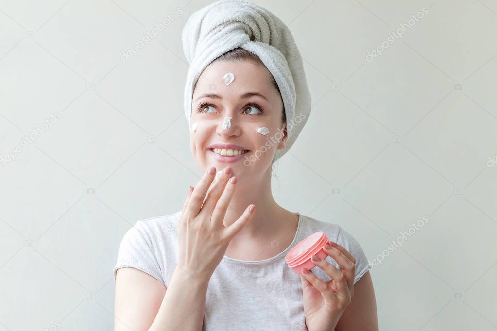 Woman face with cream or nourishing mask