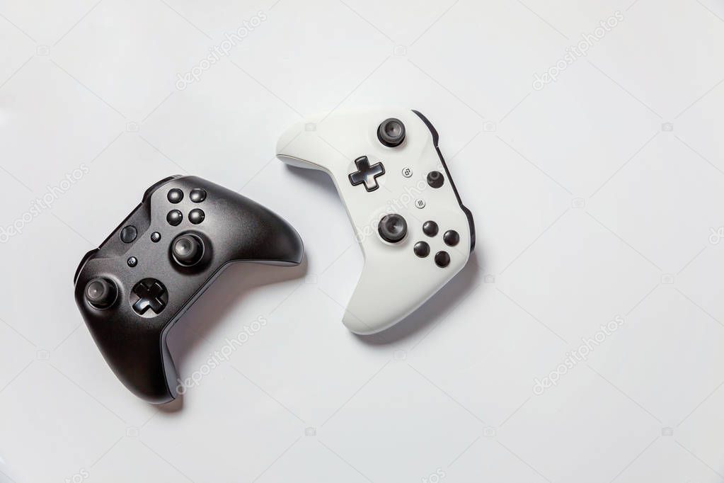 White and black joystick on white background