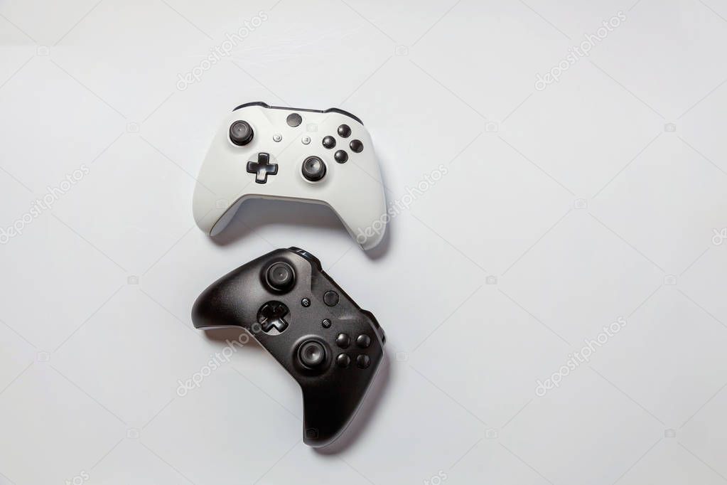 White and black joystick on white background