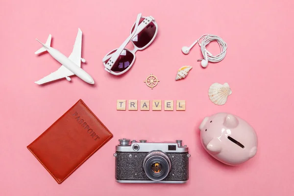 Minimal simple flat lay travel adventure trip concept on pink pastel trendy modern background