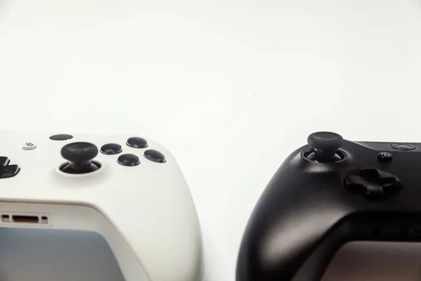 White and black two joystick on white background. Computer gaming technology play competition videogame control confrontation concept — Stock Photo, Image