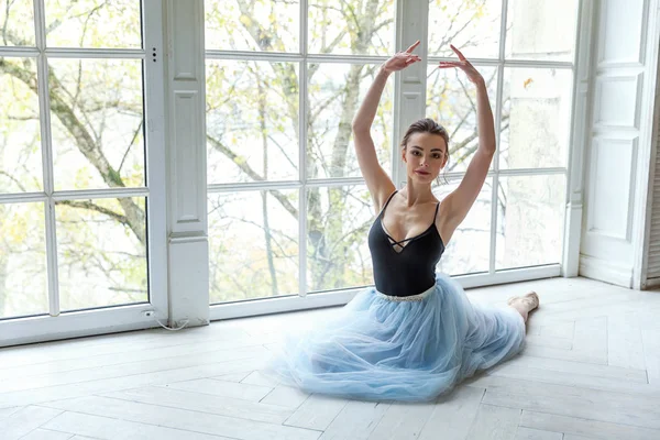 Young classical ballet dancer woman in dance class