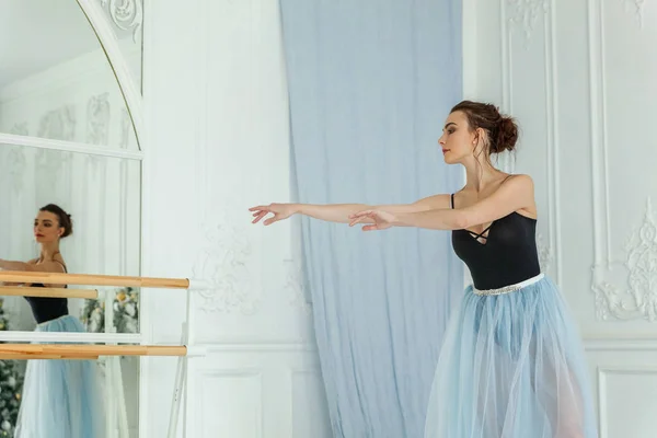 Young classical ballet dancer woman in dance class