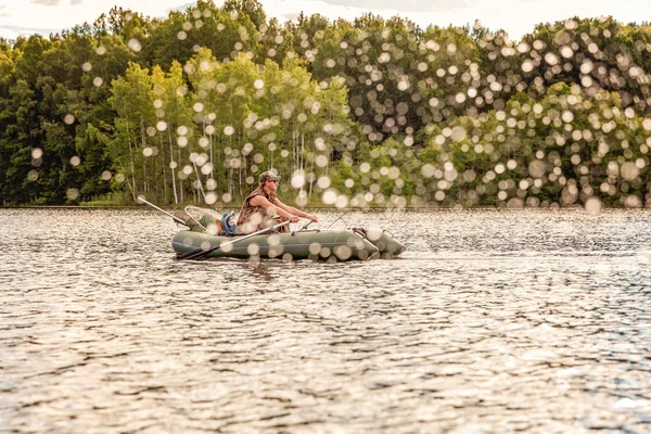 Fisherman in a boat — Stock Photo, Image