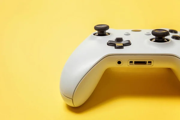 White joystick on yellow background. Computer gaming competition videogame control confrontation concept