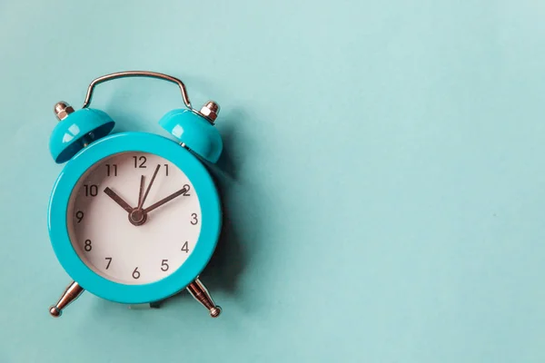 Ringing twin bell vintage classic alarm clock Isolated on blue pastel colorful trendy background. Rest hours time of life good morning night wake up awake concept — Stock Photo, Image