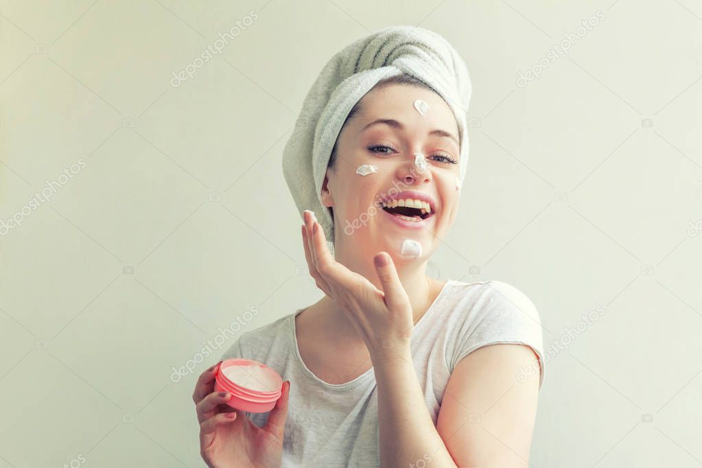 Woman face with cream or nourishing mask