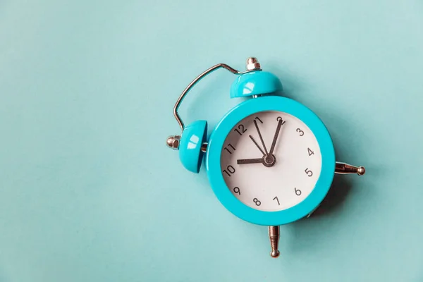 Ringing twin bell vintage classic alarm clock Isolated on blue pastel colorful trendy background. Rest hours time of life good morning night wake up awake concept — Stock Photo, Image