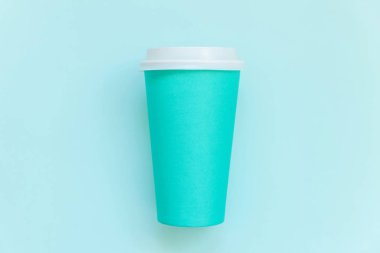 Simply flat lay design blue paper coffee cup on blue pastel colorful trendy background clipart