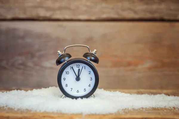 Christmas New Year Composition alarm clock on old shabby rustic wooden background — Stock Photo, Image