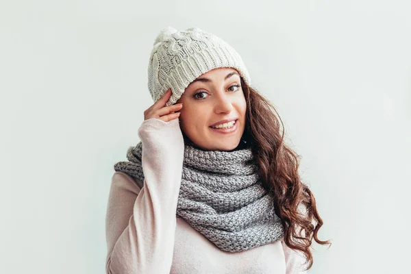 Laughing girl wearing warm clothes hat and scarf isolated on white background — Stock Photo, Image