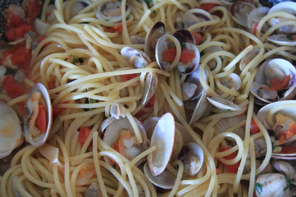 plate of spaghetti with clams served on a serving dish