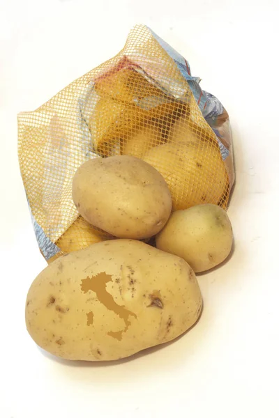 Kartoffelgruppe mit Konfekt und Herzsymbol — Stockfoto