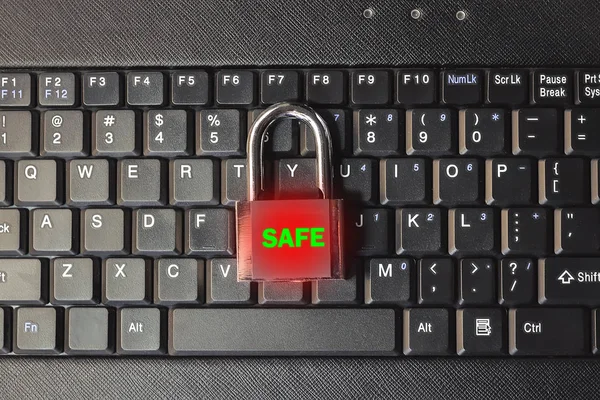 The concept of a cyber threat and security. closed lock on keyboard.