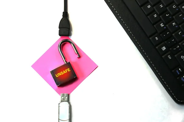 The concept of a cyber threat and security. open lock between the flash drive and the computer processor. cyber threat.