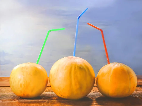 fruit melons and straws for juice