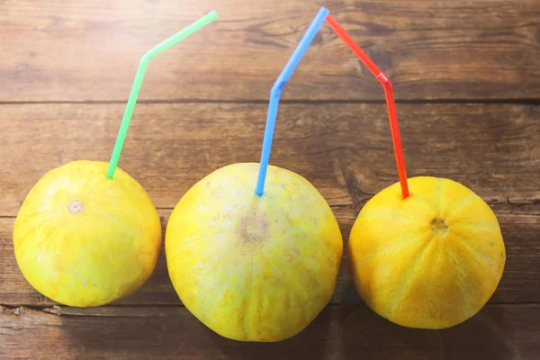 fruit melons and straws for juice
