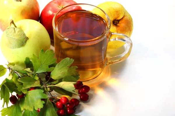 apple juice and ripe apples on a white background.