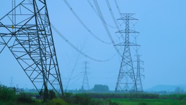 High Voltage Transmission Towers Long Rows — Stock Video