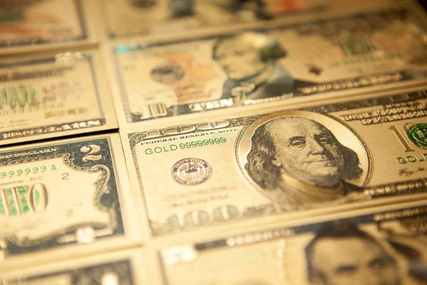 Valuta oss golden dollar sedlar närbild bakgrund. — Stockfoto