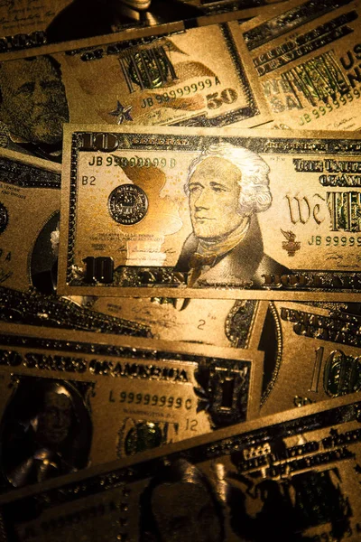 Valuta oss golden dollar sedlar närbild bakgrund. — Stockfoto