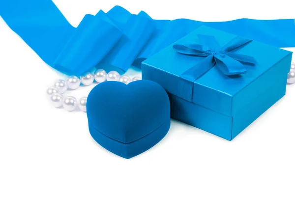 Gift box, heart ring gift box, blue ribbon and pearl beads — Stock Photo, Image