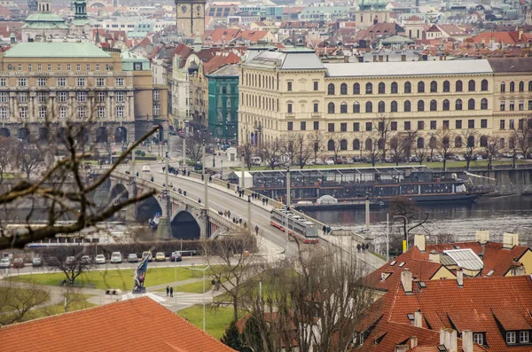 Vltava river crossed by the Charles bridge and the buildings of Prague city. Czech Republic