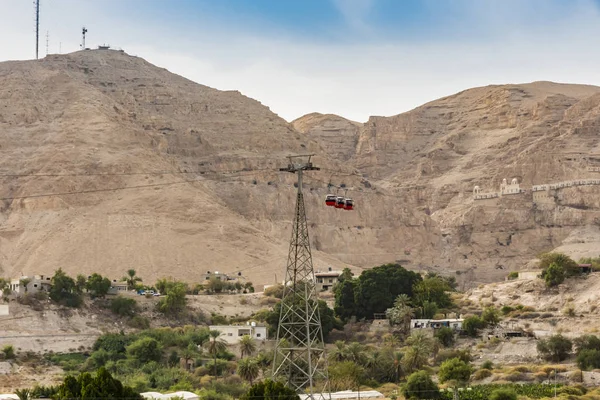 jordan valley where you can see the cable car heading to the ancient monastery of the temptations on the slopes of the mountain of the same name. Jericho Palestinian West Bank