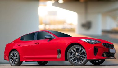 Şehir ortamında bir arka plan üzerinde kırmızı bir araba. Araba tasarım çözümleri için şık, modern, parlak görüntü.