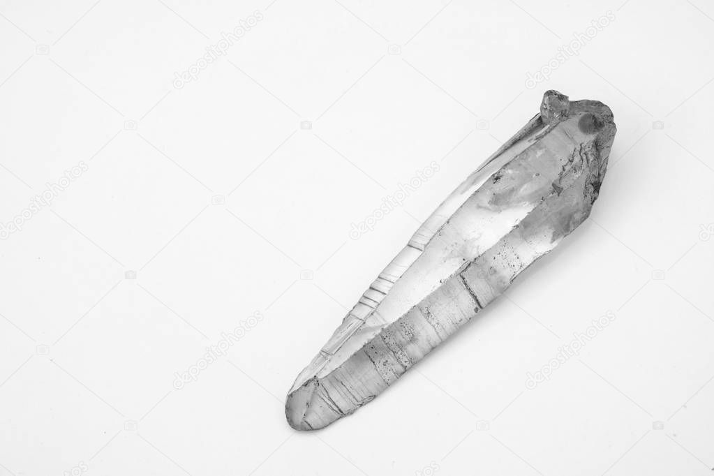 large crystal of natural quartz on a white background