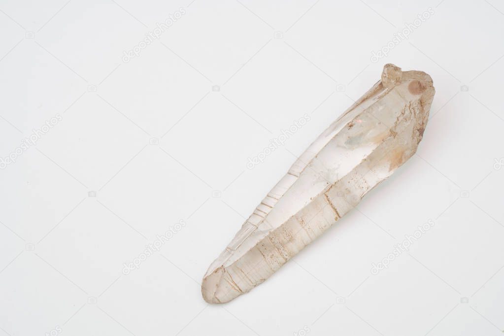 large crystal of natural quartz on a white background