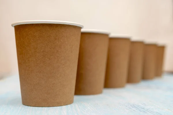 Brown disposable paper cups for drinks.