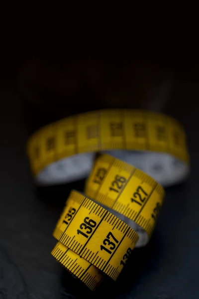 Yellow measurement tape, close up