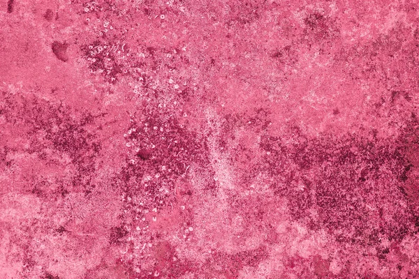 Texture of uneven plaster, abstract pink background