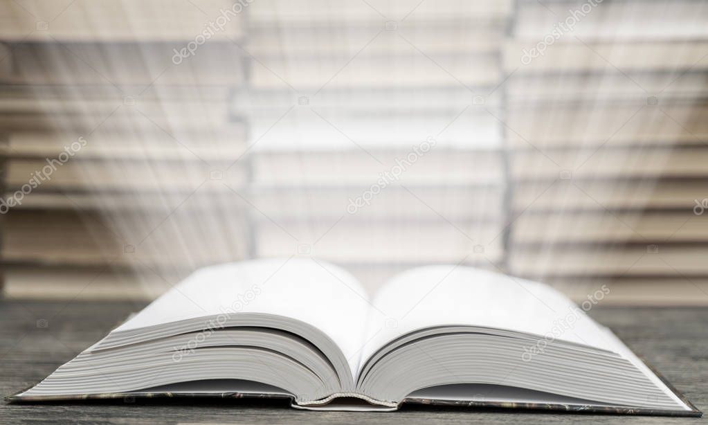 Close up of open book with rays of light