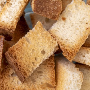 Rusks - dried cubes of white wheat bread clipart