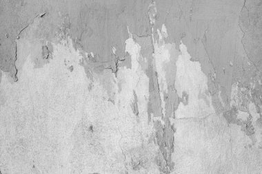 Çizik ve çatlaklarla dolu bir duvar parçası.