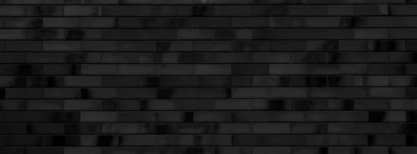 Black brick wall of building. Brick texture. Architectural abstract black background.