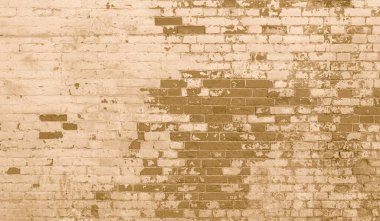 Tasarım için eski bej tuğla duvarın arka planı ve çeşitli sahneler veya video röportajları için arka plan.