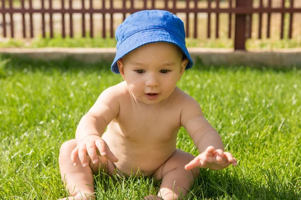 A small child is bathing in a pool, inflatable children\'s inflatable pool in summer