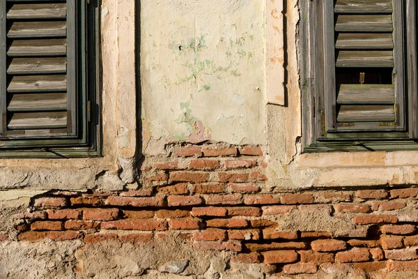 old wooden window with a white wall