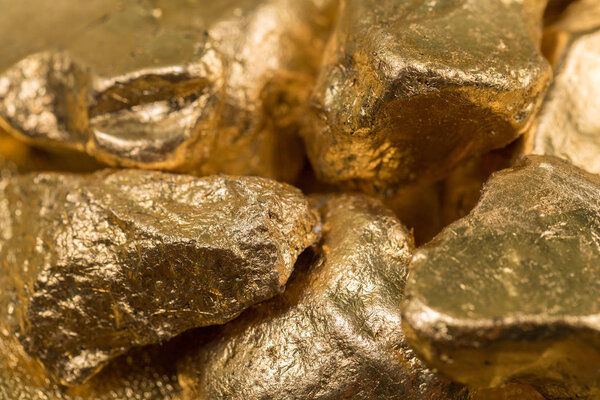 Gold nuggets on a gold background